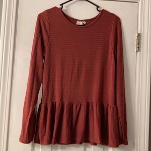 Long sleeve shirt with ruffled bottom